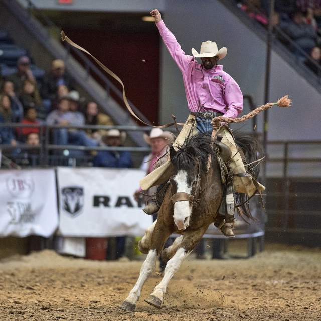Cowboy riding Bronc at WRCA World Championship Ranch Rodeo