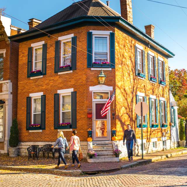People walk in Columbus' German Village neighborhood in the fall