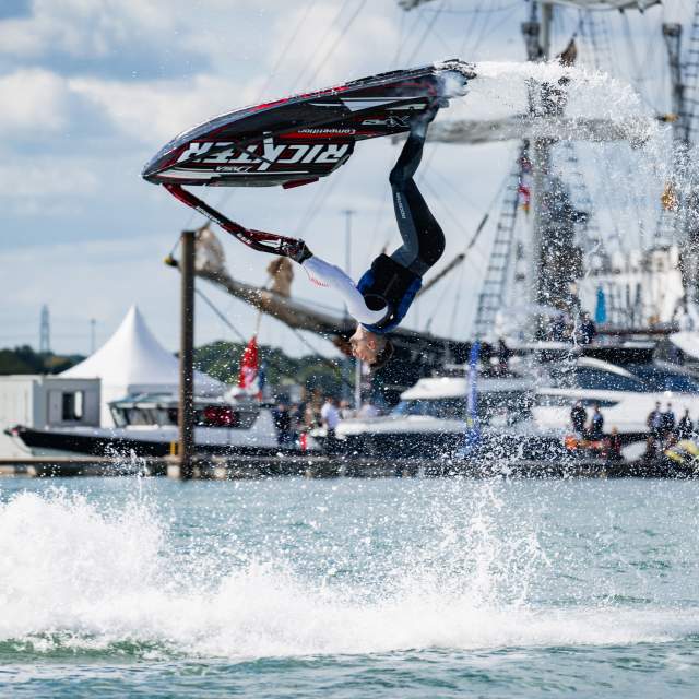 Man doing back flip on a jet ski at Southampton International Boat Show