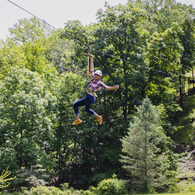 Girl ziplining in the Pocono Mountains
