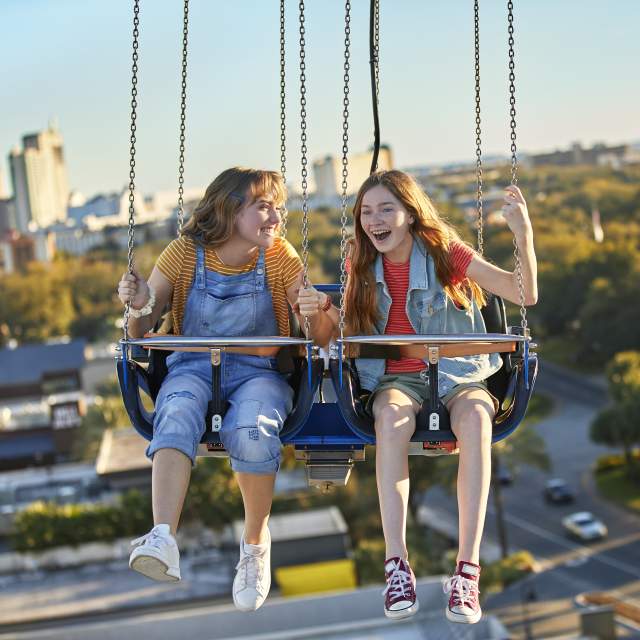 Two friends riding the Orlando Starflyer at ICON Park