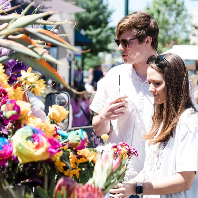 Arts in Bloom couple with flowers