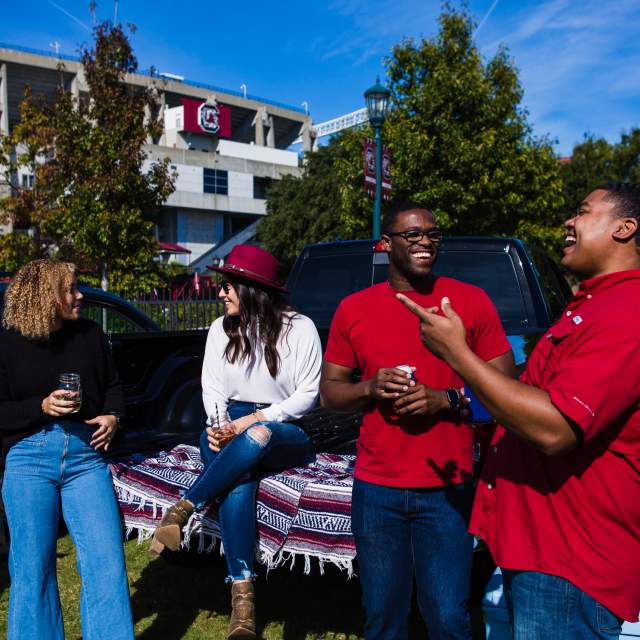 4 friends tailgating outside of Williams Brice Stadium