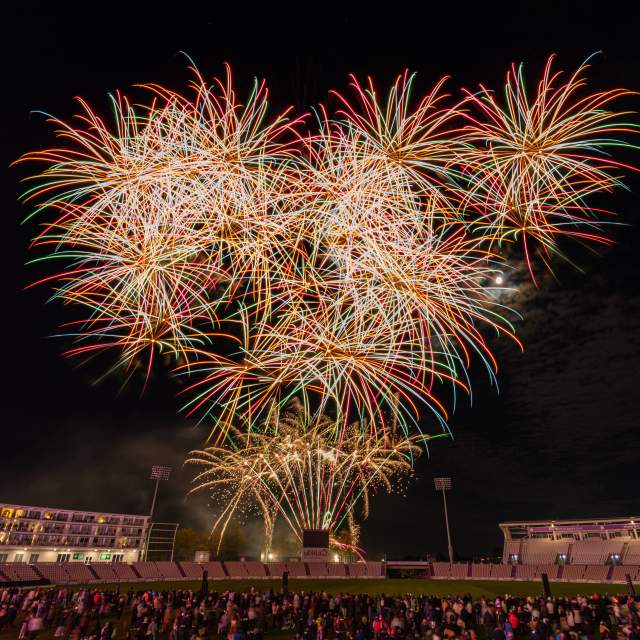 Fireworks in the night sky in front of crowd at Utilita Bowl