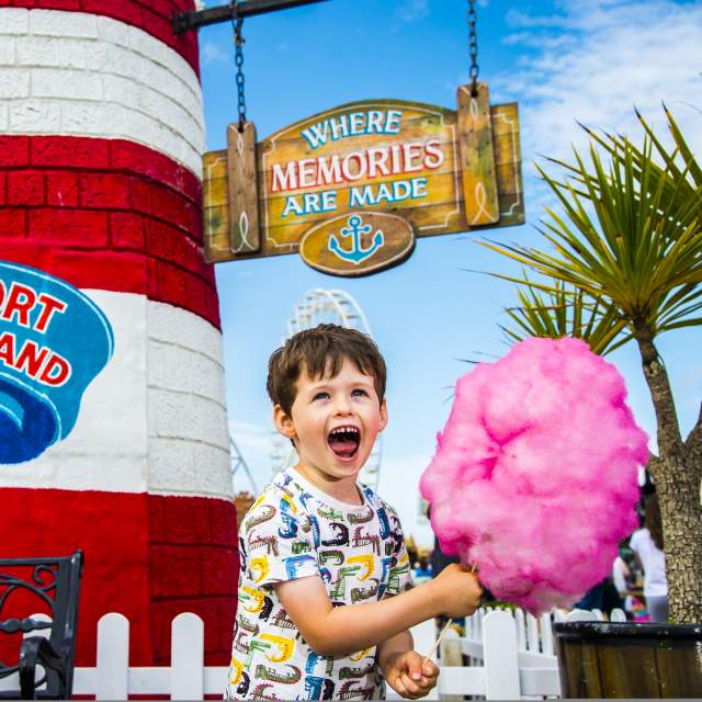 A Child with candy floss at Southport Pleasureland