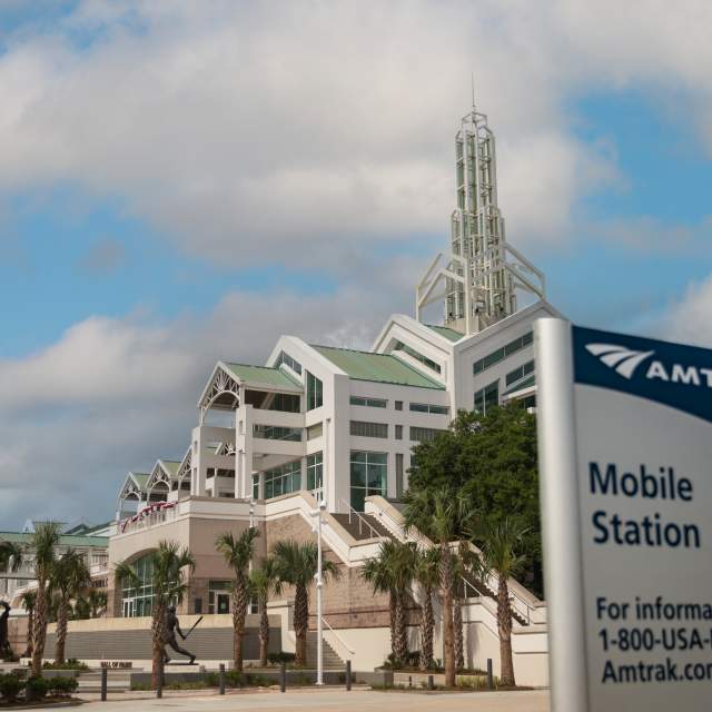 Photo of Amtrak Mobile Station sign outside of Arthur R. Outlaw Mobile Convention Center