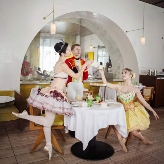 Costumed performers from The Nutcracker ballet pose at ette hotel Orlando