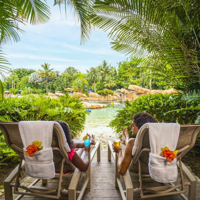 A couple relaxes at Discovery Cove, the all-inclusive day resort in Orlando.