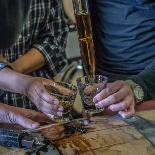 Serving whiskey at Dad's Hat