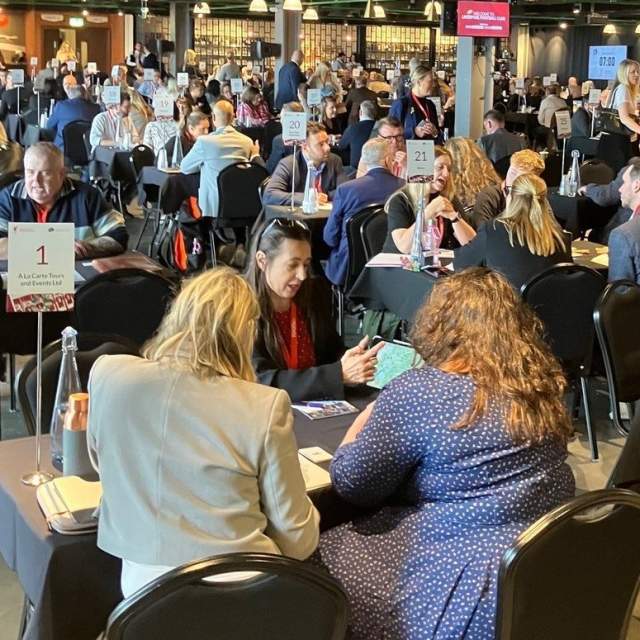A member of the Cotswolds Tourism team talks to travel trade representatives at UK Inbound