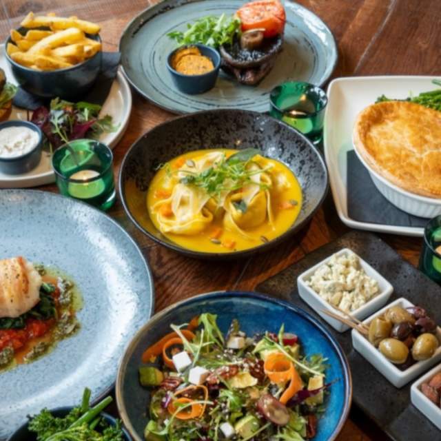 A table covered in delicious dishes at The Red Lion Long Compton in the Cotswolds