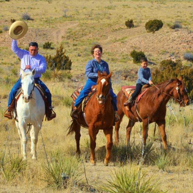 Family riding horses at Cowgirls and Cowboys in the West