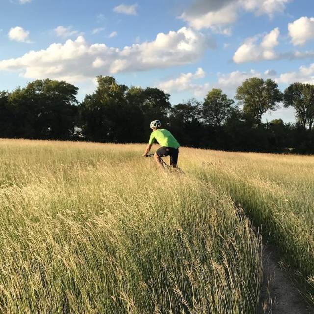 Cyclist in grassy area at Erwin Park