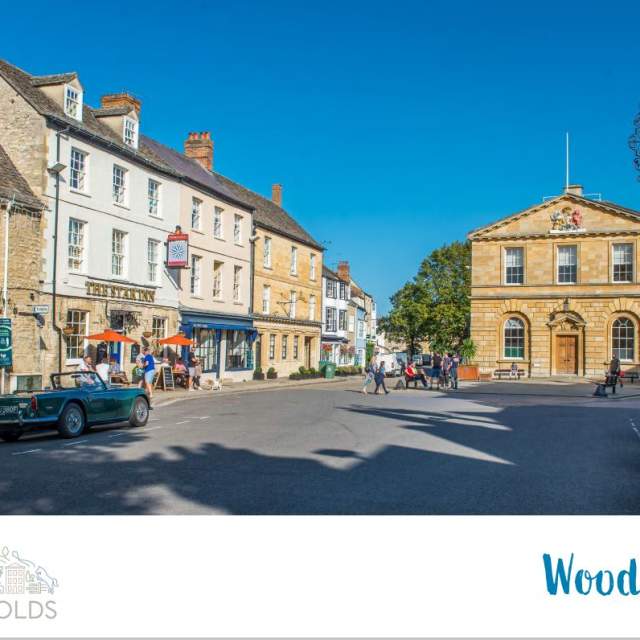 The front cover of the Woodstock digital town guide