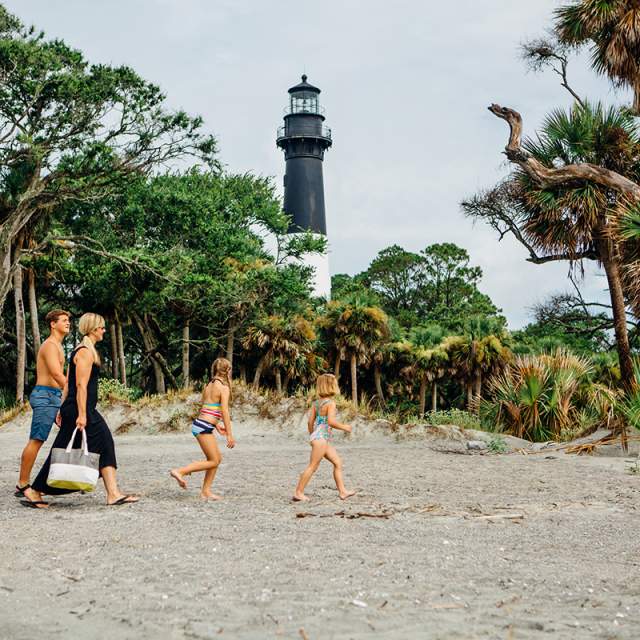 Family Walking On A Beach