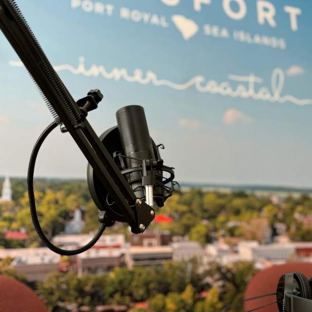 Microphone in front of a photo of downtown Beaufort
