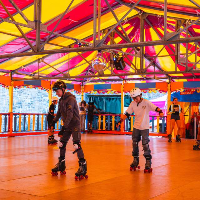 Families enjoying rollerblading in an indoor rink outside on The Esplanade by Westquay