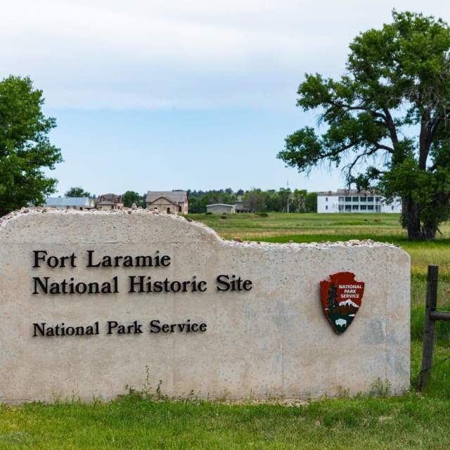 Historic structures at Fort Laramie National Historic Site surrounded by open grasslands in Goshen County, Wyoming.
