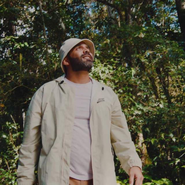 Man exploring Panama’s tropical rainforest surrounded by lush vegetation.