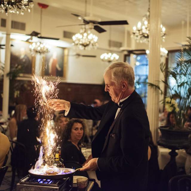 An Arnaud's employee sets fire to a pan to make café brulot