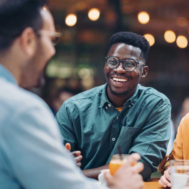 Multi-ethnic group of friends in a restaurant