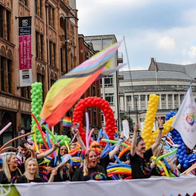 People celebrating Manchester Pride during the parade