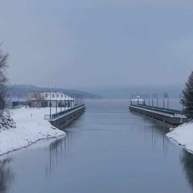 owasco lake outlet with snow covered shores