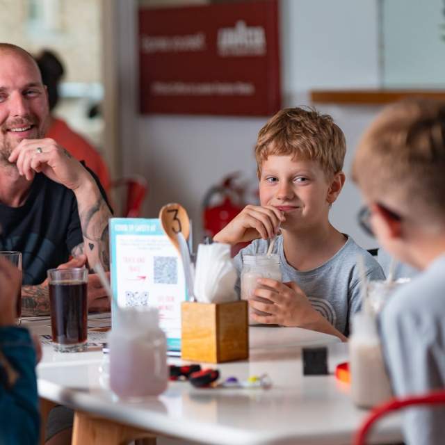 Family enjoying a meal at Stakks Pancake House