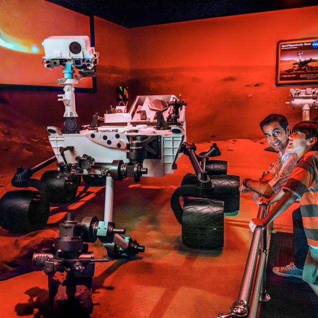 Kennedy Space Center father and son at Mars rover display