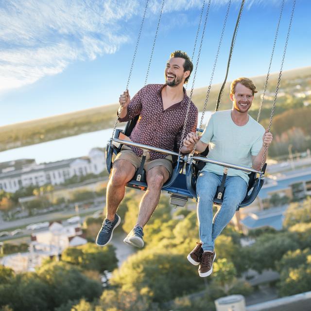 A gay couple riding the Orlando Starflyer at ICON Park