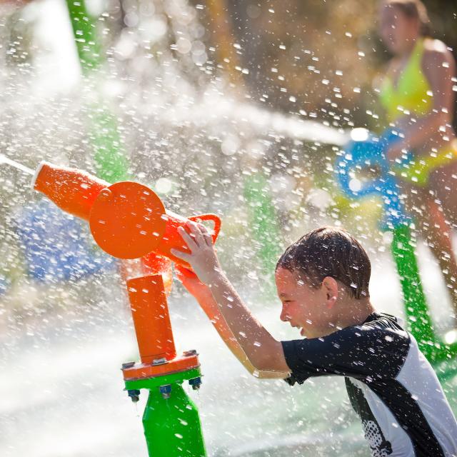 Renaissance Orlando At SeaWorld children shooting water cannon in Aqua Zone