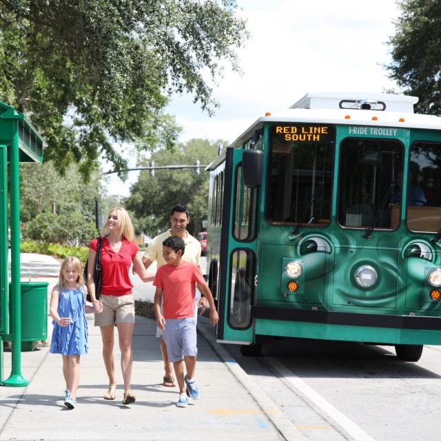 I-Ride Trolley Services family at bus stop