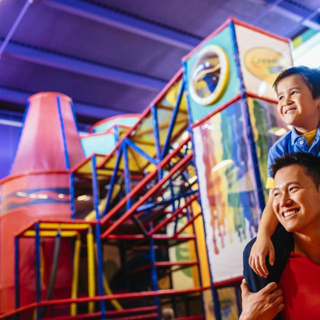 Crayola Experience father and son by playground