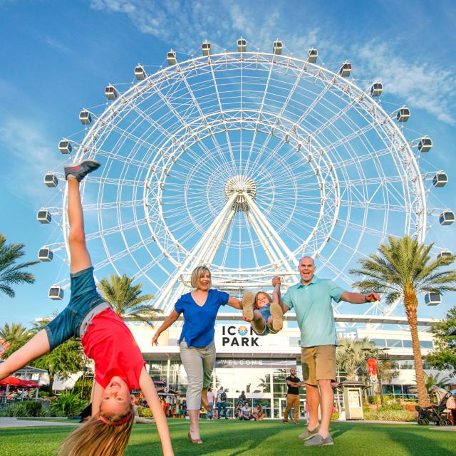 ICON Park family with daughter doing cartwheel