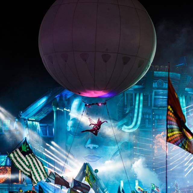 Electric Daisy Carnival performer flying above the crowd