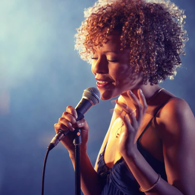Black female Singer Performing on stage