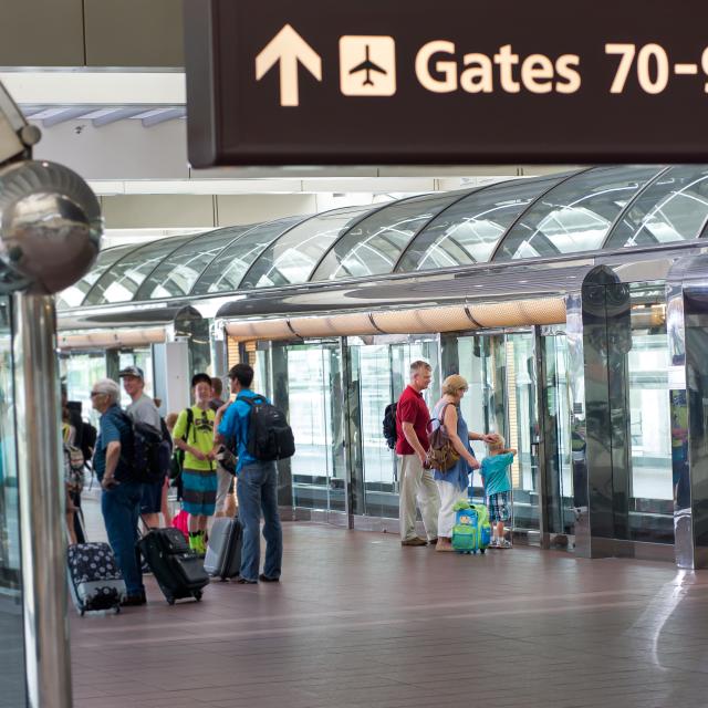 Orlando International Airport passengers waiting at APM station