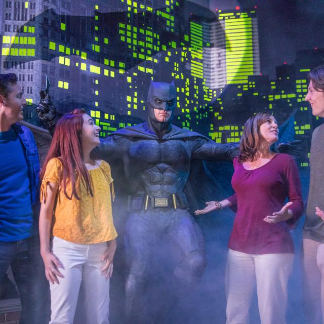 Group poses with Batman at Madame Tussauds