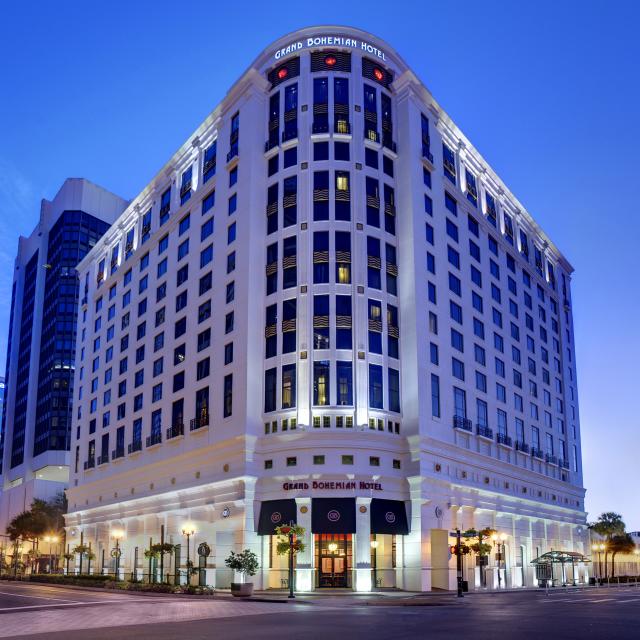 Front exterior of the Grand Bohemian Hotel in downtown Orlando at night.