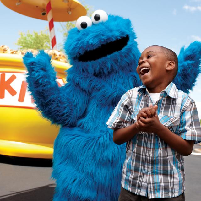 Cookie Monster greets a guest at SeaWorld's Sesame Street