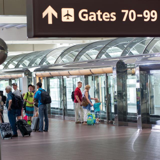 Orlando International Airport passengers waiting at APM station