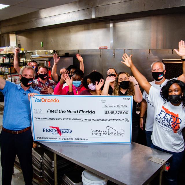 2020 Magical Dining check presentation to Feed the Need charity
