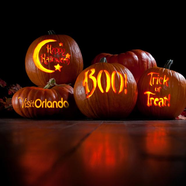 Pumpkins with Visit Orlando logo, Happy Halloween, Boo and Trick or Treat carved on them