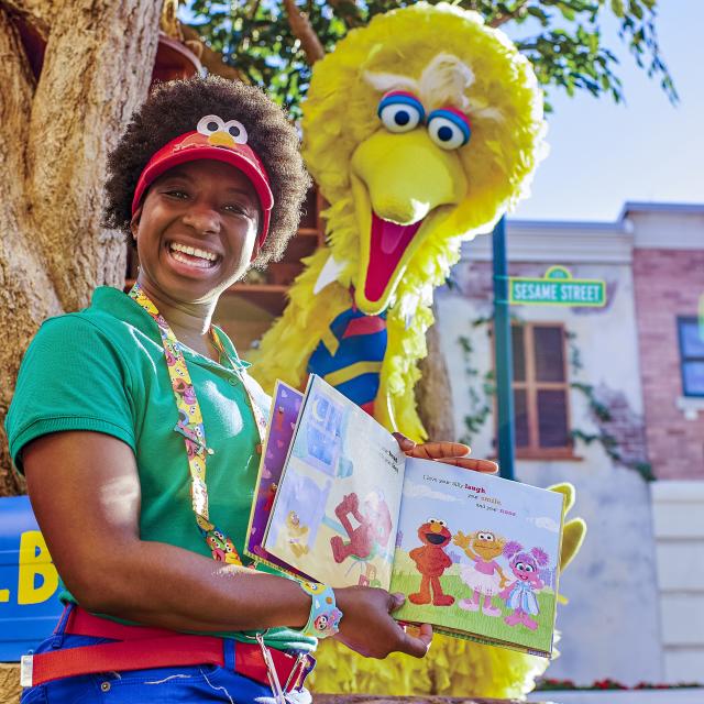 Big Bird reading a book in Sesame Street Land at SeaWorld Orlando