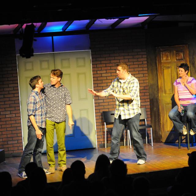 Improv actors play out a scene at SAK Comedy Lab in Orlando, Florida.