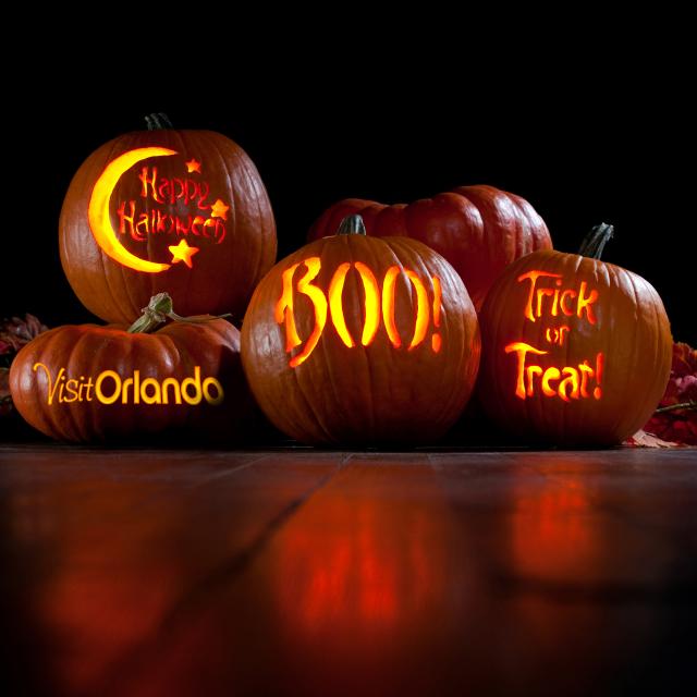 Pumpkins with Visit Orlando logo, Happy Halloween, Boo and Trick or Treat carved on them