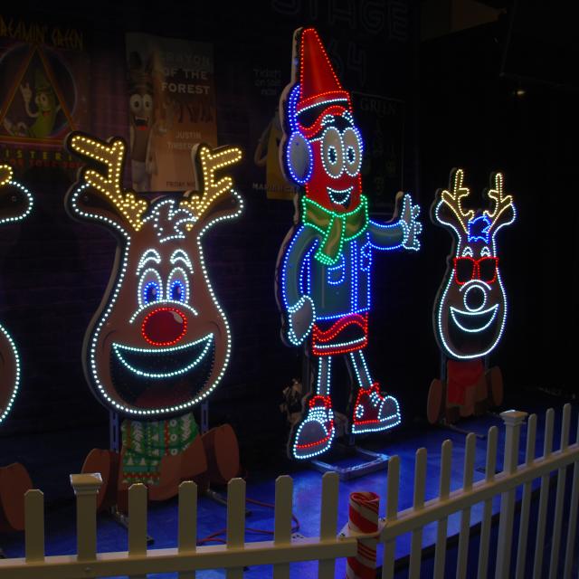 A crayon man and reindeer light display at Colorful Christmas at Crayola Experience in Orlando