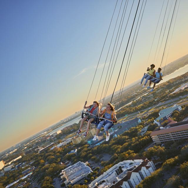 A wide shot of friends riding the Orlando Starflyer at ICON Park