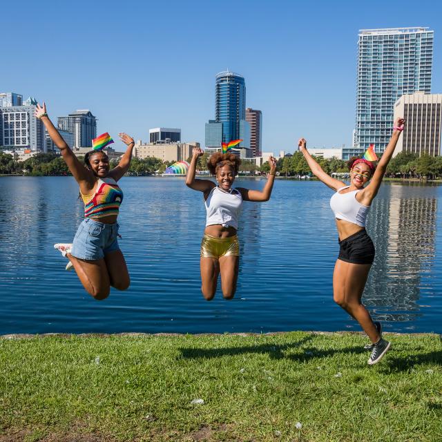 Three women celebrating at Come Out With Pride festival in Orlando.