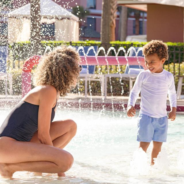 Mother and son at kiddie pool at Caribe Royale Orlando